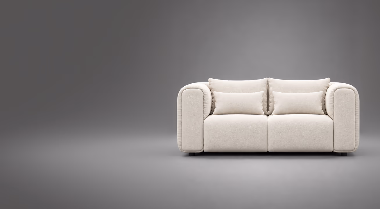 The Luma sofa in cream on a soft grey studio backdrop