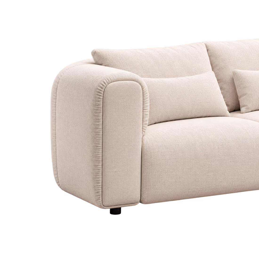 The cream Luma sofa, its rounded arm in close-up